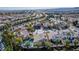 Wide aerial view showing house, pool, and surrounding neighborhood at 8986 Lillyhammer Ct, Las Vegas, NV 89147