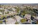 Aerial view of house with pool, neighborhood, and distant mountains at 8986 Lillyhammer Ct, Las Vegas, NV 89147