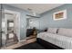 Bedroom with daybed, mirrored closet, and hardwood floors at 8986 Lillyhammer Ct, Las Vegas, NV 89147