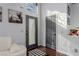 Bright entryway with gray door, hardwood floors, and a white couch at 8986 Lillyhammer Ct, Las Vegas, NV 89147