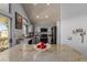 Modern kitchen with granite countertops, stainless steel appliances, and gray cabinets at 8986 Lillyhammer Ct, Las Vegas, NV 89147