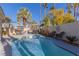 Inviting kidney-shaped pool with patio furniture at 8986 Lillyhammer Ct, Las Vegas, NV 89147