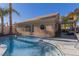 Blue pool with patio and view of house at 8986 Lillyhammer Ct, Las Vegas, NV 89147