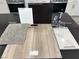 Kitchen design options with dark cabinets, quartz countertops, and vinyl plank flooring at 9189 Oakdale Ranch Ct, Las Vegas, NV 89139