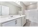 Bright bathroom featuring double vanity with a tub and shower combo at 9247 Lunar Phase St, Las Vegas, NV 89143