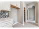 Bright kitchen with a walk-in pantry, white cabinets, gray walls, and tile flooring at 9247 Lunar Phase St, Las Vegas, NV 89143