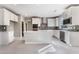 View of a bright kitchen featuring white cabinets, stainless steel appliances, and herringbone backsplash at 9247 Lunar Phase St, Las Vegas, NV 89143