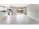 Spacious living room featuring tile flooring, neutral paint, a sliding door to the yard, and an open layout at 9247 Lunar Phase St, Las Vegas, NV 89143