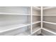 Bright white pantry featuring plenty of shelving to maximize storage and keep essentials organized at 9247 Lunar Phase St, Las Vegas, NV 89143