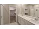 Modern bathroom boasts double vanity and walk-in shower at 9428 Noble Fir Ridge Ave, Las Vegas, NV 89143