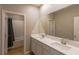 Double vanity bathroom with a soaking tub at 9428 Noble Fir Ridge Ave, Las Vegas, NV 89143