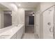 Elegant bathroom with double sinks and a separate shower at 9428 Noble Fir Ridge Ave, Las Vegas, NV 89143