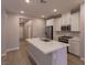 Modern kitchen with white cabinets, stainless steel appliances and island at 9428 Noble Fir Ridge Ave, Las Vegas, NV 89143