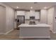 Modern kitchen with white cabinets, stainless steel appliances, and an island at 9428 Noble Fir Ridge Ave, Las Vegas, NV 89143