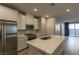 Contemporary kitchen featuring white cabinets and stainless steel appliances at 9428 Noble Fir Ridge Ave, Las Vegas, NV 89143