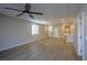 Open concept living room with hardwood floors and a view to the kitchen at 9428 Noble Fir Ridge Ave, Las Vegas, NV 89143