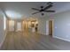 Spacious living area featuring hardwood floors and ceiling fan at 9428 Noble Fir Ridge Ave, Las Vegas, NV 89143