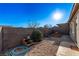 Small backyard with gravel and raised garden bed at 9465 White Fir Grove Ct, Las Vegas, NV 89143