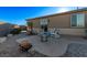 Relaxing backyard patio with fire pit and seating area, perfect for outdoor entertaining at 9465 White Fir Grove Ct, Las Vegas, NV 89143