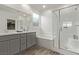 Double vanity bathroom with a shower and tub at 9465 White Fir Grove Ct, Las Vegas, NV 89143