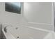 Clean bathroom with a bathtub and white subway tile at 9465 White Fir Grove Ct, Las Vegas, NV 89143