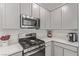 Modern kitchen with white cabinets at 9465 White Fir Grove Ct, Las Vegas, NV 89143