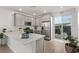 Modern kitchen with island and breakfast bar at 9465 White Fir Grove Ct, Las Vegas, NV 89143