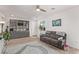 Living room with sectional sofa and rug at 9465 White Fir Grove Ct, Las Vegas, NV 89143