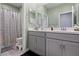 Clean bathroom with dual vanity and shower/tub combo at 3957 Little Creek Ave, Las Vegas, NV 89141