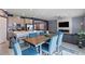 Kitchen dining area with a wood table and blue chairs at 3957 Little Creek Ave, Las Vegas, NV 89141