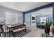 Open dining room with light wood floors and blue walls at 3957 Little Creek Ave, Las Vegas, NV 89141