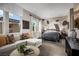 Bedroom with sitting area and abstract wall art at 10130 Sequoia Glen Ave, Las Vegas, NV 89166