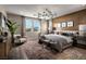 Spacious main bedroom with wood wall accents and large windows at 10130 Sequoia Glen Ave, Las Vegas, NV 89166