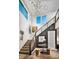 Modern staircase with metal railing and wood steps at 10130 Sequoia Glen Ave, Las Vegas, NV 89166