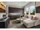 Modern wet bar with ample cabinetry and seating area at 10130 Sequoia Glen Ave, Las Vegas, NV 89166