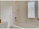 Clean bathroom with shower/tub combo and a block window at 1028 Norellat Rd, Henderson, NV 89011