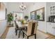 Elegant dining room with a large table, comfortable chairs, and stylish decor at 1057 Daylight Blaze Way, Henderson, NV 89052