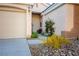 Front entry with walkway and mature plants at 1057 Daylight Blaze Way, Henderson, NV 89052