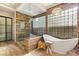 Spa-like bathroom with soaking tub and glass shower at 109 Aventura St, Las Vegas, NV 89144