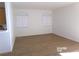 Spacious living area with neutral walls and wood-look flooring at 1405 S Nellis Blvd # 1075, Las Vegas, NV 89104