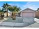 Cute ranch house with desert landscaping and a two-car garage at 15 Warm Glen Ave, North Las Vegas, NV 89031