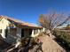 Backyard view of house with landscaping at 2124 Spring Water Dr, Las Vegas, NV 89134