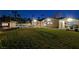Spacious backyard with pool, grass, and patio at 3104 Conners Dr, Las Vegas, NV 89107