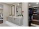 Bathroom boasts a double sink vanity with modern fixtures, and entrance to a large walk-in closet at 3104 Conners Dr, Las Vegas, NV 89107