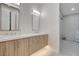 Modern bathroom with double sinks, sleek wood cabinets, and ample counter space at 3104 Conners Dr, Las Vegas, NV 89107