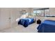 Bright bedroom with blue quilts and a window offers a comfortable and inviting space at 3104 Conners Dr, Las Vegas, NV 89107