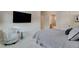 Comfortable bedroom with a cozy chair and a view into the bathroom through the open door at 3104 Conners Dr, Las Vegas, NV 89107