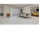 Elegant dining area with seating for six, filled with natural light and modern fixtures at 3104 Conners Dr, Las Vegas, NV 89107