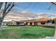 Beautiful single story home featuring a brick facade, well-kept lawn, and circular garden bed at 3104 Conners Dr, Las Vegas, NV 89107