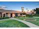 Lovely front yard featuring a patterned brick walkway and lush greenery, set against a clear sky at 3104 Conners Dr, Las Vegas, NV 89107